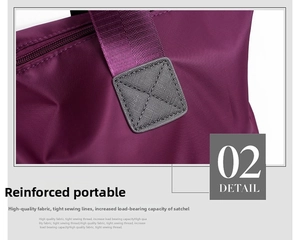 Detail of reinforced purple nylon handle with cross-stitching for heavy load support