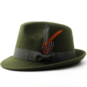 Detail of dark green wool felt hat featuring a grey ribbon bow and colorful feathers