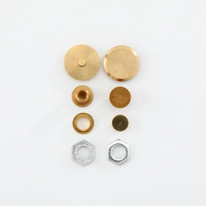 Precision walnut clock hand copper set with brass cylinders and hex nuts on white background