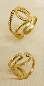 Detailed macro view of gold 18K hollow knot textured adjustable stainless steel ring