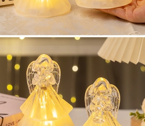 Detail of crystal LED angel lamps with warm glow and intricate frosted textures