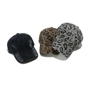 Three-pack vintage leopard print baseball caps in navy, brown, and grey with glossy texture