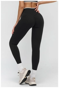 Dettaglio dei leggings da yoga neri a vita alta con cuciture a V e bordo bianco
