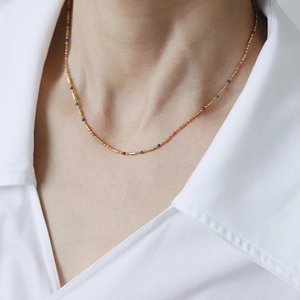 Rainbow beaded chain necklace in 18K gold plated stainless steel worn by a model