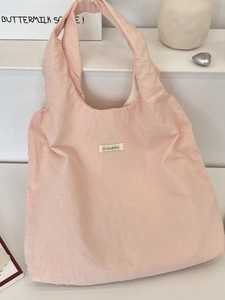Pink lazy style canvas tote bag with textured dot fabric and minimalist shoulder design