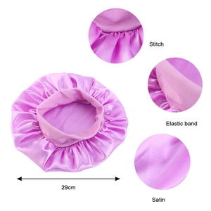 Detail of 29cm purple satin sleep cap showing elastic band, stitch and fabric texture