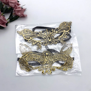 Detail of black and gold lace masquerade masks with intricate vintage hollow patterns