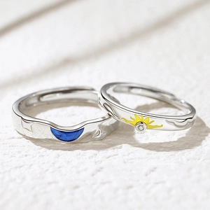 Adjustable sun and moon couple rings with blue enamel and sparkling stone accents