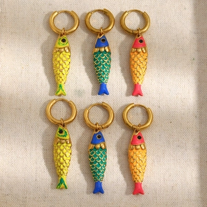 Detail of colorful enamel fish drop earrings in 18K gold plated stainless steel