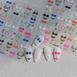 Detail view of 3D embossed colorful bikini nail art stickers with various patterns