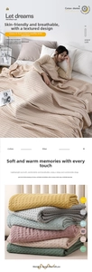 Macro detail of breathable cotton waffle knit texture and multi-color blanket stack