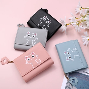 Close-up of four colors of cartoon cat tri-fold wallets with cute cat paw metal pendants
