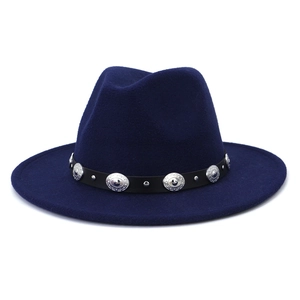 Close-up of navy blue wool fedora hat featuring a black leather belt with silver buckle
