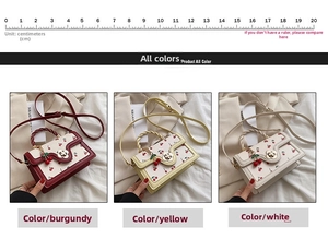 Detailed view of cherry print leather handbags with floral clasp and woven handles