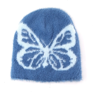 Winter knit beanie featuring blue butterfly pattern and fuzzy mohair texture for warmth