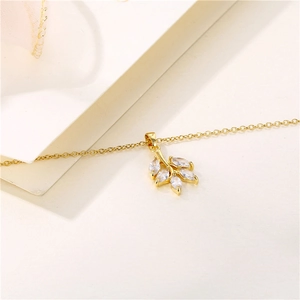 Minimalist 18K gold leaf pendant necklace with micro-pave white zircon crystals