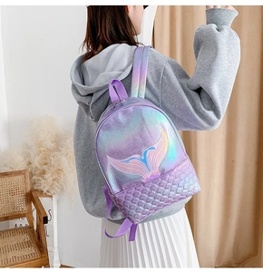 Detail of mermaid tail scales pattern on laser purple backpack with holographic PU finish