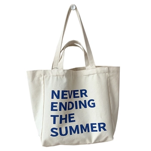 Minimalist cream canvas tote bag with blue 'Never Ending Summer' text and shoulder straps