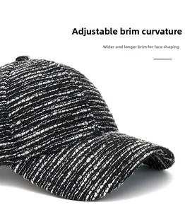 Detail of tweed baseball cap showing a flexible curved brim and woven texture