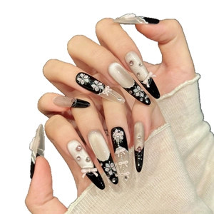Floral luxury press-on nails with violet cat-eye effect and 3D ribbon bows