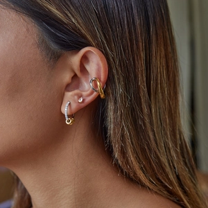 Modern minimalist two-tone 18K gold-plated stainless steel earrings with sparkling white diamonds