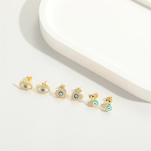 Minimalist gold-plated evil eye stud earrings set with heart and bear shapes