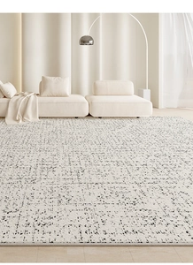Macro detail of cream-colored waterproof rug with modern black abstract dot patterns