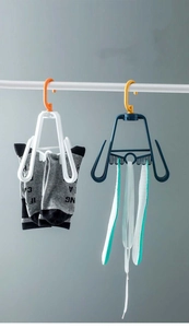 Detail of rotating multi-functional shoe drying rack with hooks for socks and small items