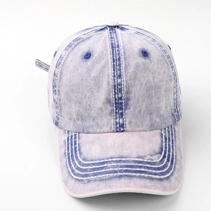 Detail view of vintage washed cotton baseball cap with color block stitching and soft top