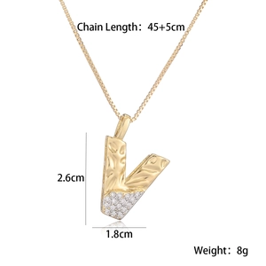 Detail showing two-tone initial V pendant with dimensions 2.6cm by 1.8cm and 50cm chain length