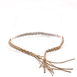 Ethnic style braided hat band with fringe tassel detail on a minimalist hat stand
