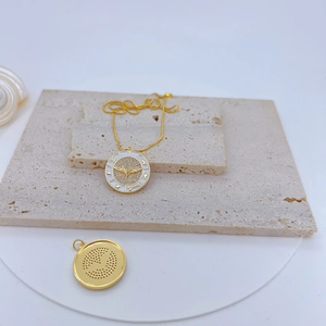 Gold-plated evil eye pendant necklace with micro-pave crystals and star patterns