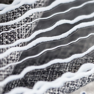 Minimalist grey nail art stickers with white 3D wavy lines and woven texture details