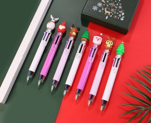 Detailed view of Christmas multi-color pens with silicone Santa and reindeer toppers