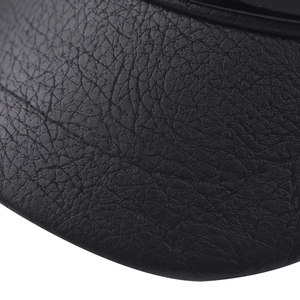 Close-up detail of high-quality black PU leather texture on a stylish military cap