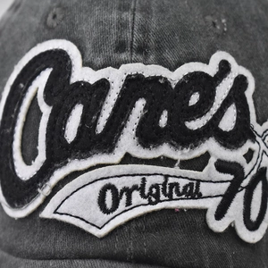Washed dark grey baseball cap with vintage Canes embroidery and distressed details