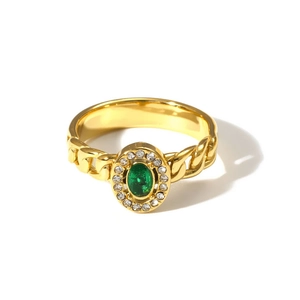 Detailed top view of 18K gold double layer ring with green stone and cubic zirconia
