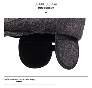 Detail view of thickened ear flaps and warm lining on winter outdoor beret for men