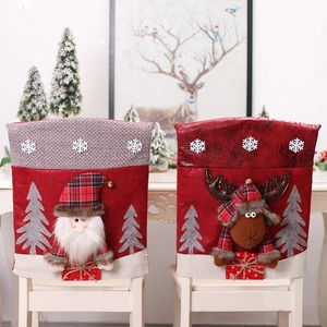 Christmas chair covers featuring 3D Santa and Reindeer designs on white chairs