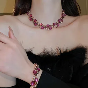 French vintage luxury jewelry set with purple floral rhinestones on gold necklace and bracelet