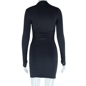 Rear view of sleek black long-sleeve bodycon mini dress featuring smooth knitted fabric