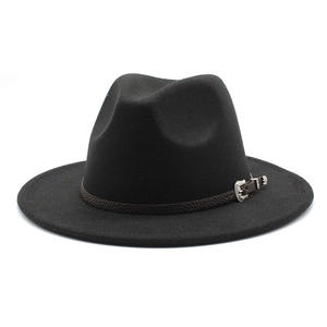 Detail of black wide brim fedora with vintage silver buckle and faux leather strap
