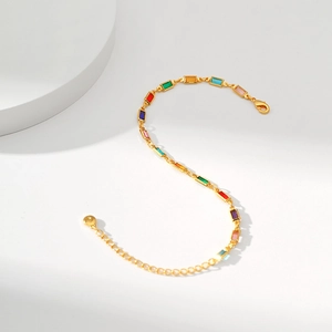 Detail of 18K gold-plated chain bracelet featuring multi-colored rectangular crystals