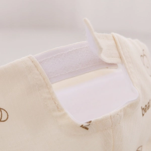 Close-up of adjustable velcro strap and soft cotton bear print on baby baseball cap
