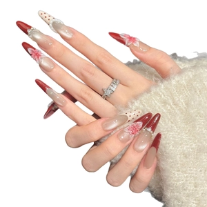 Handmade press-on nails with red gradient cat-eye finish and 3D flower rhinestones
