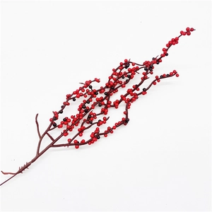 Close-up of artificial red berries with glitter for Christmas tree DIY decor