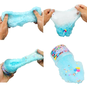 Blue slushie slime toy with colorful beads and charms shown in various stretched poses