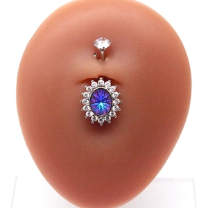 Detail of silver belly ring with rainbow oval stone and crystals on silicone model