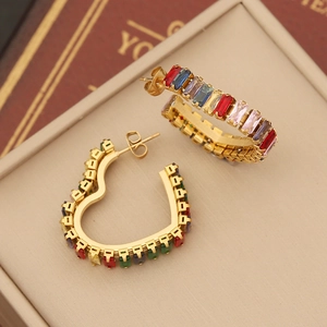 Golden C-shaped hoop and heart earrings with colorful baguette-cut cubic zirconia