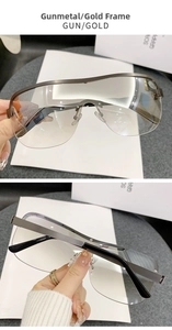 Detail view of gunmetal semi-rimless cycling sunglasses with gold mirrored lenses